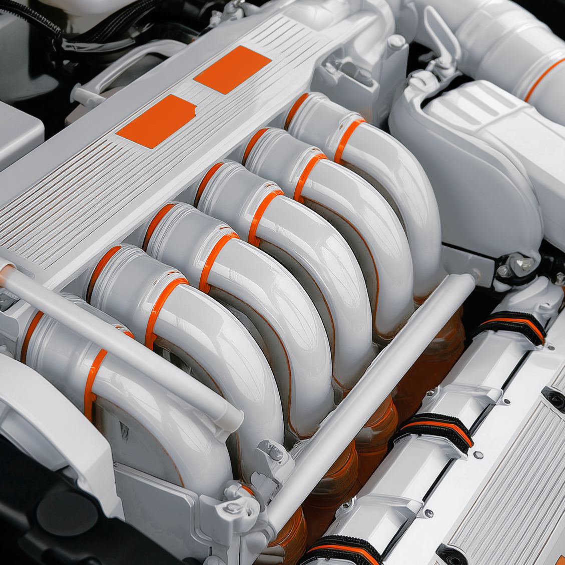 White engine manifold with orange accents